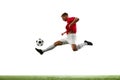 Aerial Symphony of Soccer. Athleticism. Portrait of soccer maestro orchestrates airborne pass, the ball dancing through