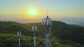 Aerial Of Technician Sitting On Top Of Telecommunications Tower At Sunset Royalty Free Stock Photo