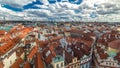 Aerial timelapse view of the traditional red roofs of the city of Prague, Czech Republic with the church of St. Jilji