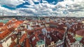 Aerial timelapse view of the traditional red roofs of the city of Prague, Czech Republic with the church of St. Jilji