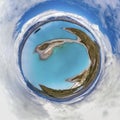 Aerial tiny planet of the blue lake and small island