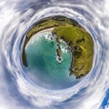 Aerial tiny planet of the green cliffs and blue ocean