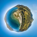 Aerial tiny planet of sandy beach and ocean shore