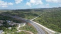 Aerial of the toll road in Jamaica with Vehicular cars driving