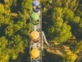 Aerial top directly above view of ferris wheel in summer amusement public city park, drone shot d