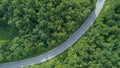 AERIAL TOP DOWN: Cinematic view of empty country road in rural part of Slovenia. Royalty Free Stock Photo