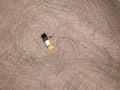 Aerial top down drone shot. Parking with tire tracks and broken yellow car. Rostov-on-Don. Russia. Royalty Free Stock Photo