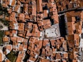 Aerial top down drone view on Piran town with narrow streets, ancient buildings with red roofs and Piazza 1. Maggio in southwester Royalty Free Stock Photo