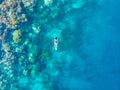 Aerial top down people snorkeling on coral reef tropical caribbean sea, turquoise blue water. Indonesia Banyak Islands Sumatra,