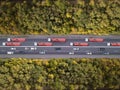 Aerial top down shot of highway with truck trailer and the car. Royalty Free Stock Photo