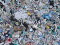 AERIAL: View from above of a stinky heap of garbage in a plastic sorting site Royalty Free Stock Photo