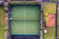 Aerial top down view on a basketball open air ground in a student camp of a college or university. Sport outdoor facility for