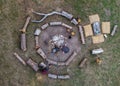 Aerial top down view of Big campfire With Circles of Logs. Bonefire for ecological Mode of life. Everyday life Cooking