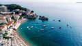 Aerial top down view of boat dock and yacht port in Montenegro. White private motor boats are moored to pier on Adriatic sea coast Royalty Free Stock Photo