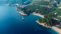 Aerial top down view of boat dock and yacht port in Montenegro. White private motor boats are moored to pier on Adriatic sea coast Royalty Free Stock Photo