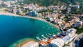 Aerial top down view of boat dock and yacht port in Montenegro. White private motor boats are moored to pier on Adriatic sea coast Royalty Free Stock Photo