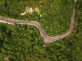 Mountain winding zig zag road. Top aerial view: cars driving on road from above. Royalty Free Stock Photo