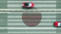 Aerial top down view of cars and flag of Japan on the road. Traveling related conceptual 3D rendering Royalty Free Stock Photo