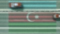 Aerial top down view of cars revealing flag of Azerbaijan on the road. Traveling related conceptual 3D rendering