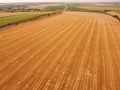 Aerial view crop wheat rolls of straw in field Royalty Free Stock Photo