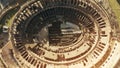 Aerial top down view of crowded Colosseum or Coliseum amphitheatre in Rome, main landmark of the city and Italy Royalty Free Stock Photo