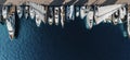 Aerial top-down view of docked sailboats