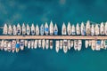 Aerial top-down view of docked sailboats