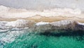 Aerial top down view with drone of a Mediterranean beach with clear blue water