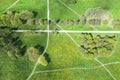 Aerial top down view on a footpaths junction in a green park