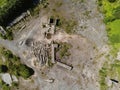 Aerial top down view on industrial buildings on an abandoned stone quarry. Construction yard for processing rocks and pebble Royalty Free Stock Photo