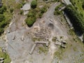 Aerial top down view on industrial buildings on an abandoned stone quarry. Construction yard for processing rocks and pebble Royalty Free Stock Photo