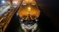 Aerial View of a Large Ship Under Construction in a Dry Dock at Night vessel shipyard Royalty Free Stock Photo