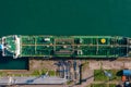 Aerial top down view oil ship tanker vessel loading in gas and oil terminal station refinery, Global trading import Royalty Free Stock Photo