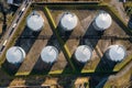 Aerial top down view of oil tanks at oil refinery. Gas and oil steel storage tanks. Petrol industrial plant