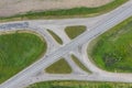 Aerial top down view of road interchange or intersection with no traffic on the road. Green field Royalty Free Stock Photo