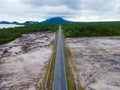 Aerial top down view of road scenery in deforested and forest area. Royalty Free Stock Photo