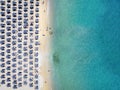 Aerial top down view of the rows of sun umbrellas at Elia Beach, Mykonos