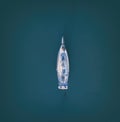 Aerial top down view of sailing yacht anchored in the open sea Royalty Free Stock Photo