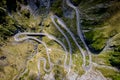 Aerial top down view of serpentine narrow road. A road full of twists and turns winding Royalty Free Stock Photo