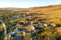 Aerial top down view of solar photo voltaic panels in green rural area. Clean renewable energy in private village environment Royalty Free Stock Photo