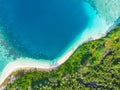 Aerial top down view tropical paradise pristine beach rainforest blue lagoon bay coral reef caribbean sea turquoise water at Royalty Free Stock Photo