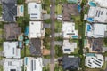 Aerial top down view of an upmarket suburban street lined with modern prestige homes, Australia