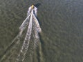 Aerial top down view of Watertaxi speed boat cruising through river Royalty Free Stock Photo