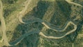 Aerial top down view of a windy hairpinned road in mountains. Andalusia, Spain