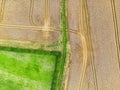 Aerial top shot of an agricultural field in Leeds West Yorkshire with tractor marks
