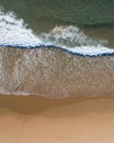 Aerial top shot of a beach with nice sand, blue turquoise water and tropical vibe Royalty Free Stock Photo