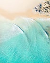Aerial top shot of a beach with nice sand, blue turquoise water and tropical vibe Royalty Free Stock Photo