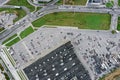 Aerial top view from above of big shopping mall and parking lot with cars Royalty Free Stock Photo