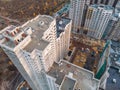 Aerial or top view from above, construction of modern houses or buildings with cranes and other industrial vehicles Royalty Free Stock Photo