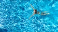 Aerial top view of active woman in swimming pool from above, girl swims in blue water, tropical vacation, holiday on resort Royalty Free Stock Photo